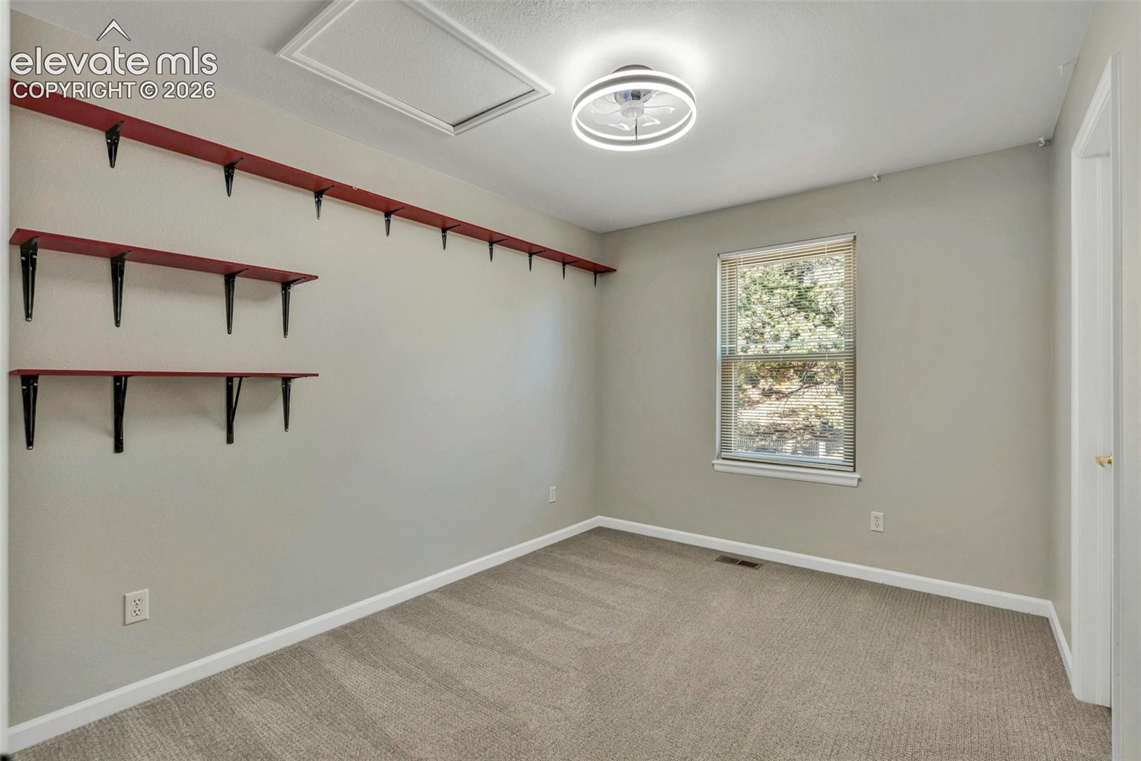 17370 Sweet Road Peyton, CO 80831 - Photo 32 of 47 Unfurnished room featuring light carpet and baseboards