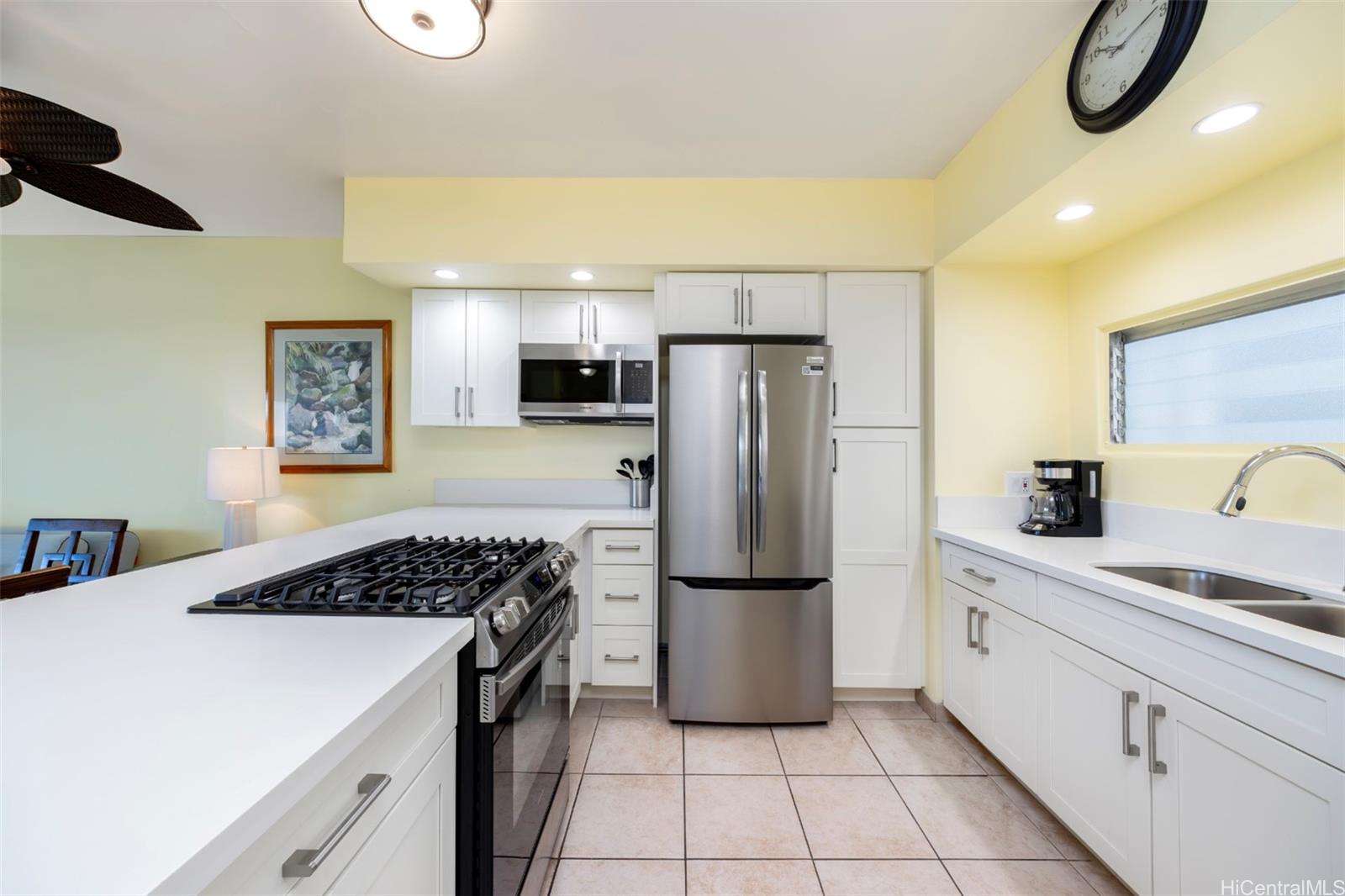 2161 Kalia Road, Unit 218 Honolulu, HI 96815 - Photo 14 of 25 a kitchen with a refrigerator and a sink