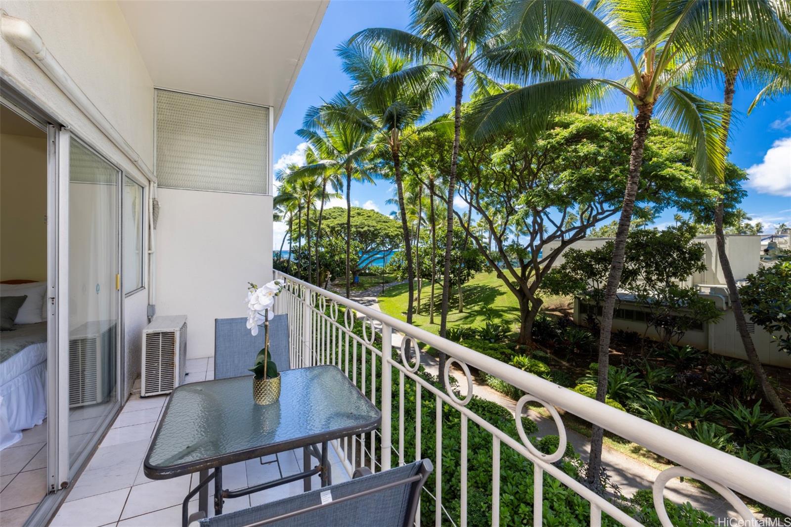 2161 Kalia Road, Unit 218 Honolulu, HI 96815 - Photo 2 of 25 a view of balcony with wooden floor and outdoor seating
