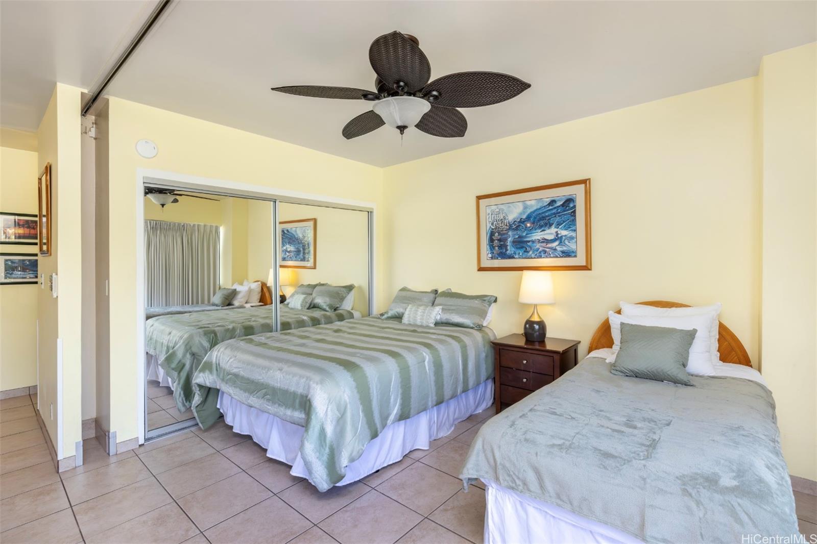2161 Kalia Road, Unit 218 Honolulu, HI 96815 - Photo 8 of 25 a spacious bedroom with two beds and painting on the wall