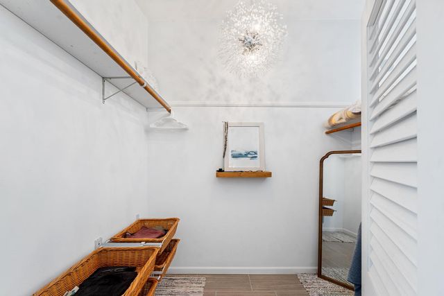 a bathroom with a granite countertop sink and a bathtub