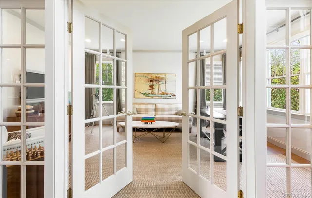 a view of a balcony with table and chairs