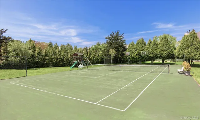 a view of an outdoor space and tennis court
