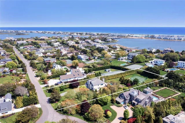 an aerial view of residential houses and outdoor space