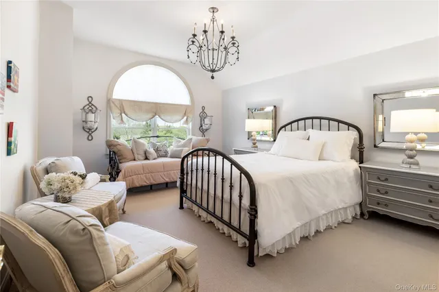 a bedroom with bed and a window