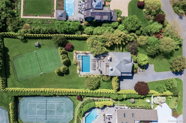 an aerial view of a house with a garden and pool table