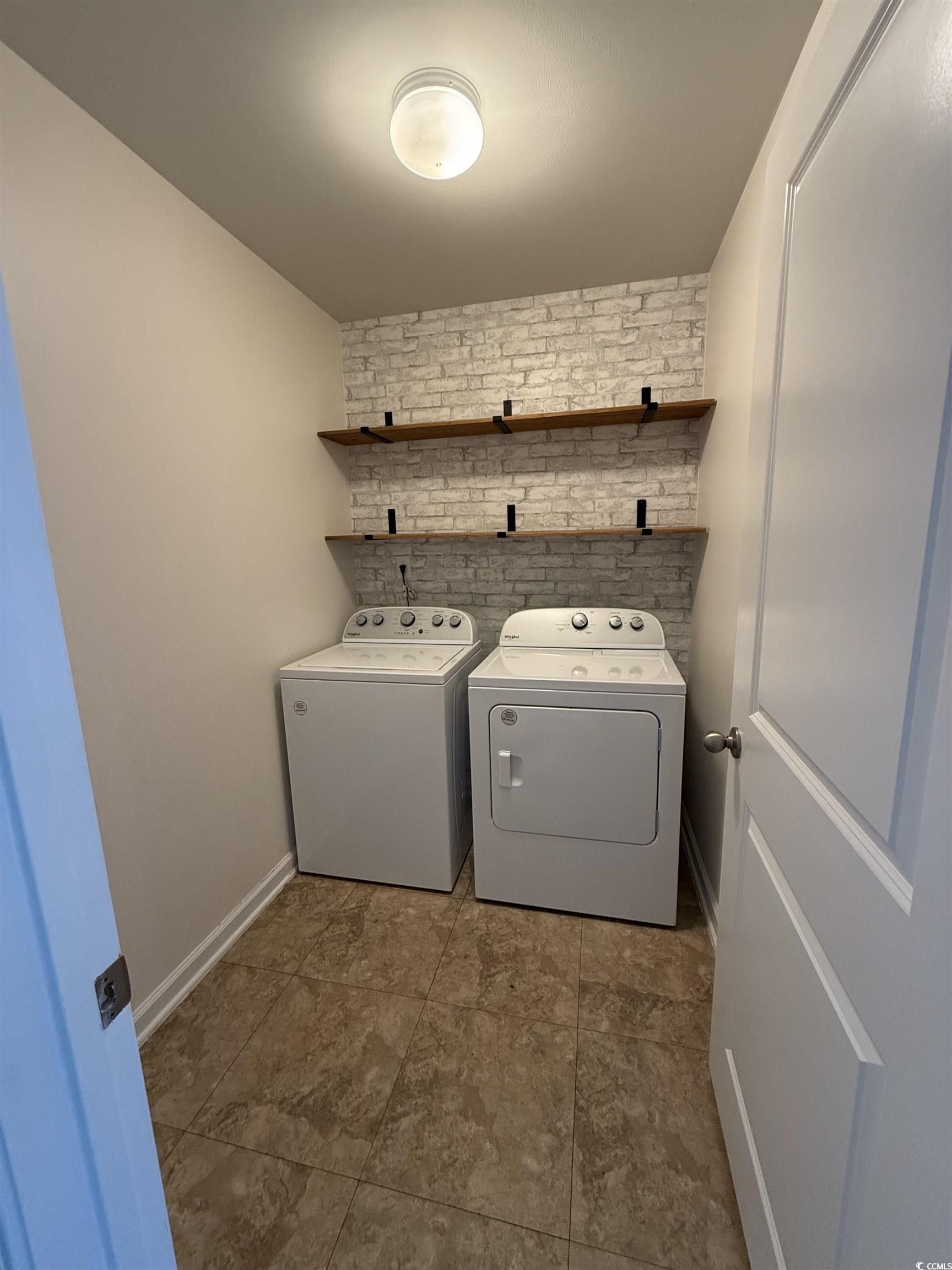 462 Quinta Street Longs, SC 29568 - Photo 9 of 39 Laundry room with washing machine and clothes dryer and baseboards