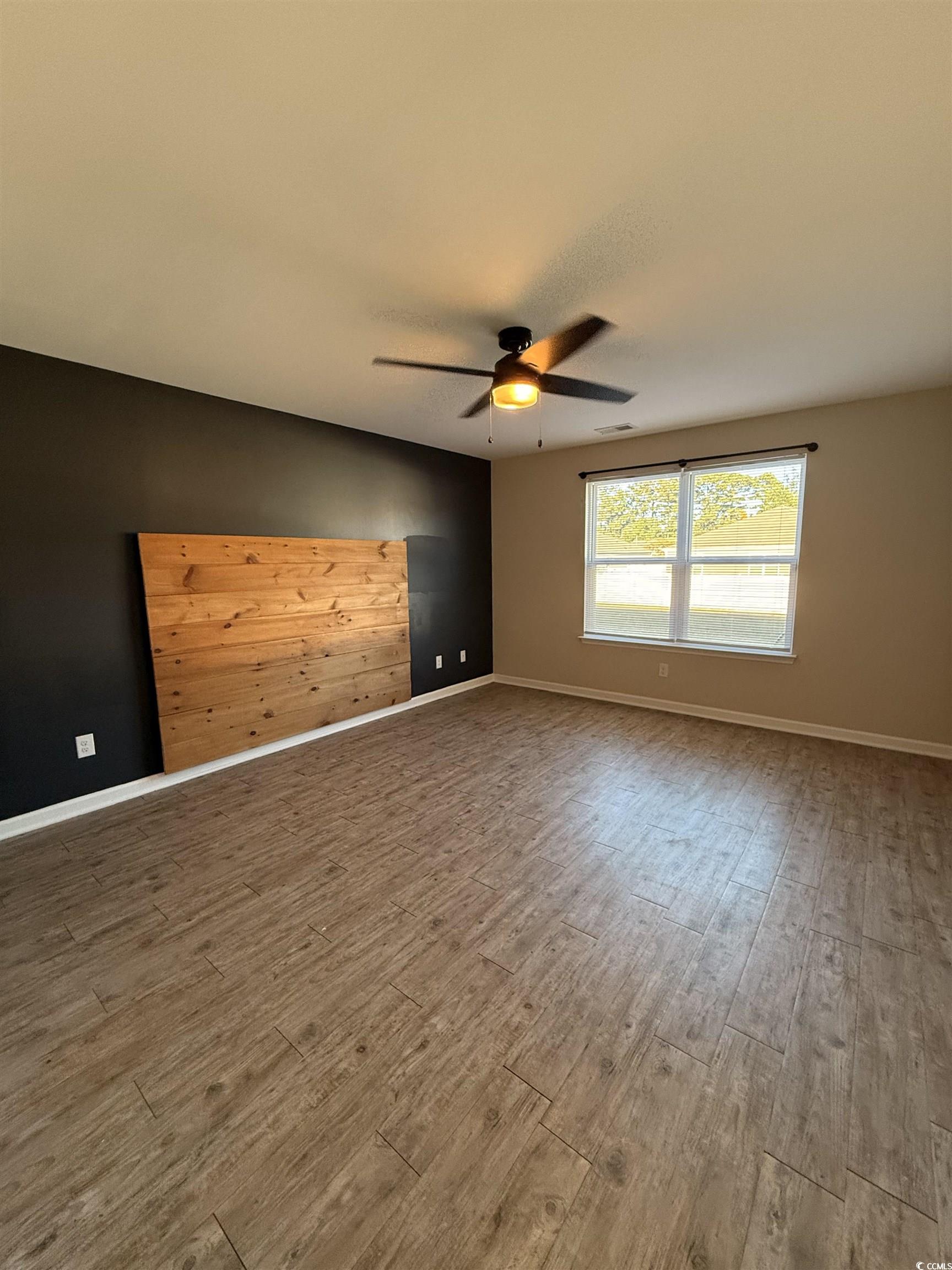 462 Quinta Street Longs, SC 29568 - Photo 11 of 39 Empty room featuring wood finished floors and a ceiling fan
