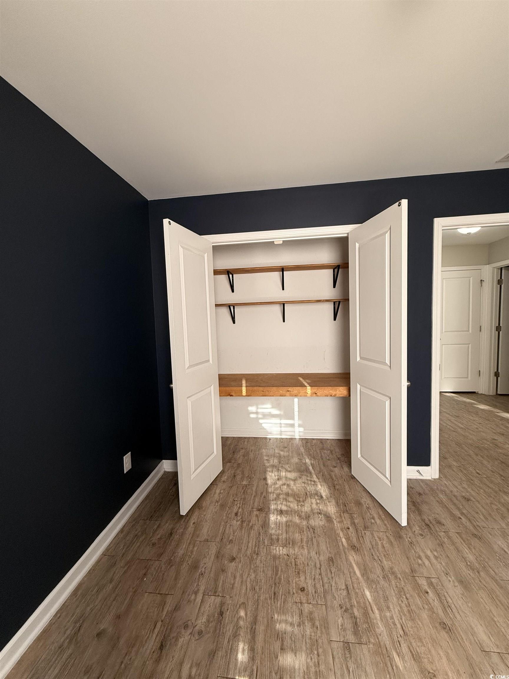 462 Quinta Street Longs, SC 29568 - Photo 19 of 39 Unfurnished bedroom with light wood finished floors and baseboards