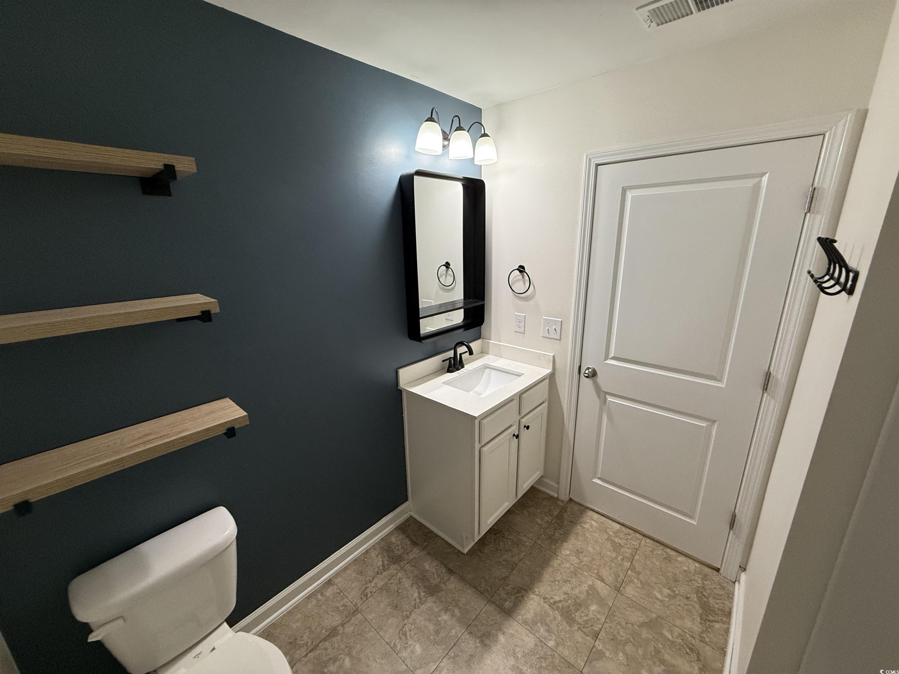 462 Quinta Street Longs, SC 29568 - Photo 23 of 39 Half bath featuring vanity and toilet