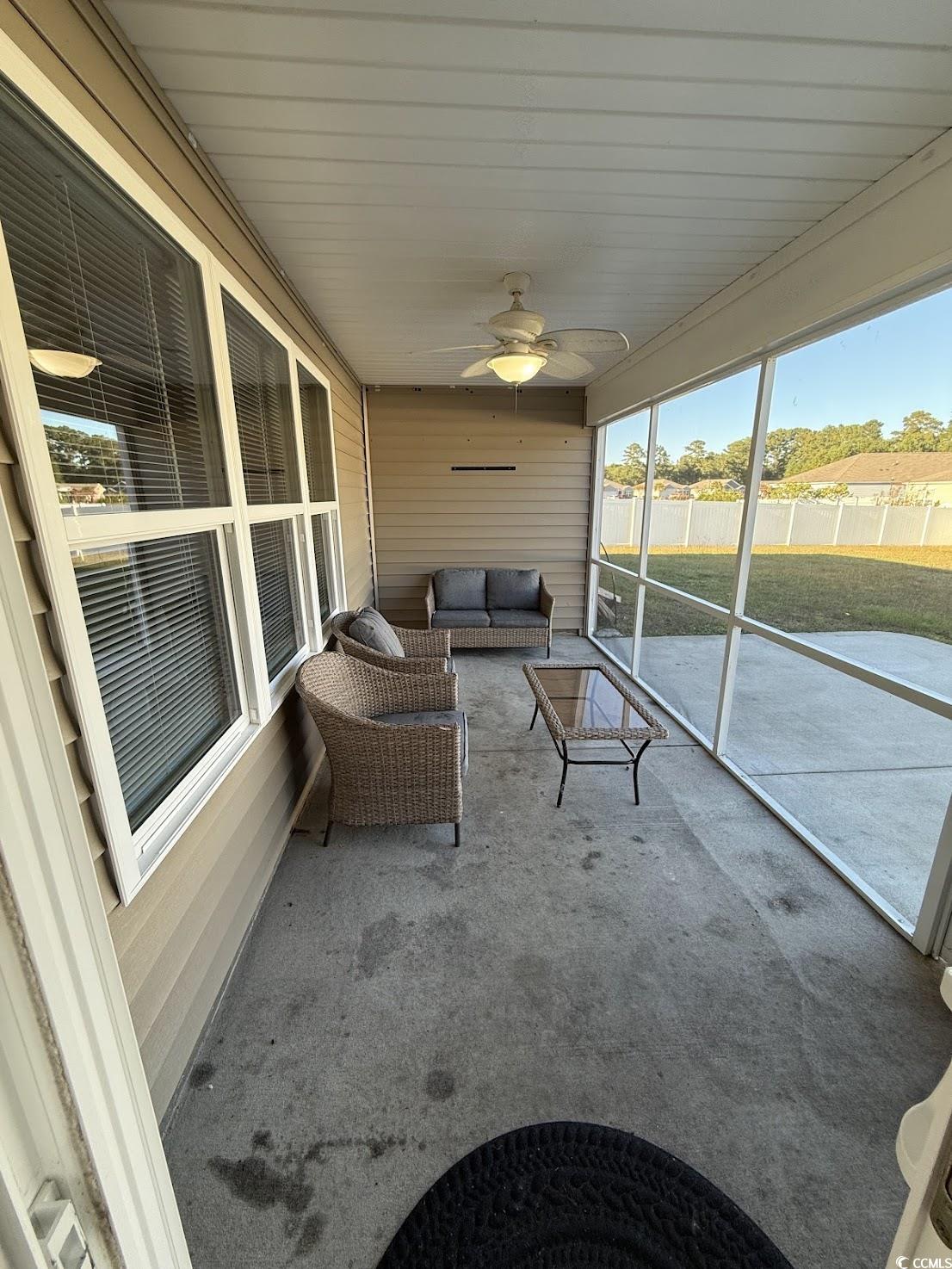 462 Quinta Street Longs, SC 29568 - Photo 32 of 39 Sunroom / solarium featuring ceiling fan and outdoor lounge area