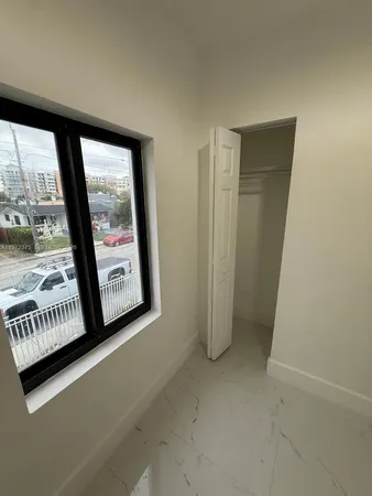 an empty room with windows