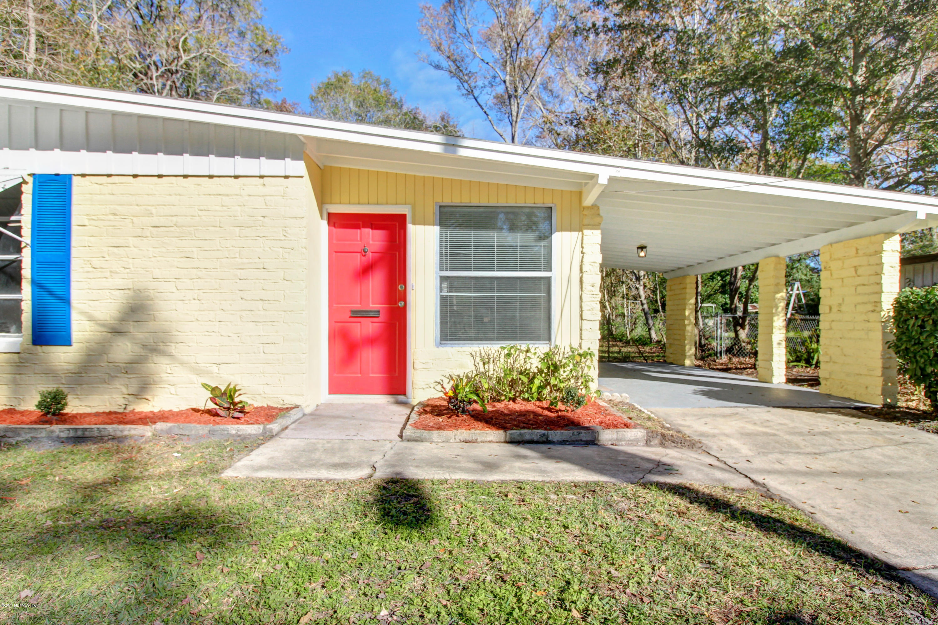 7003 Arques Road Jacksonville, FL 32205 - Photo 1 of 24 a front view of a house with a yard