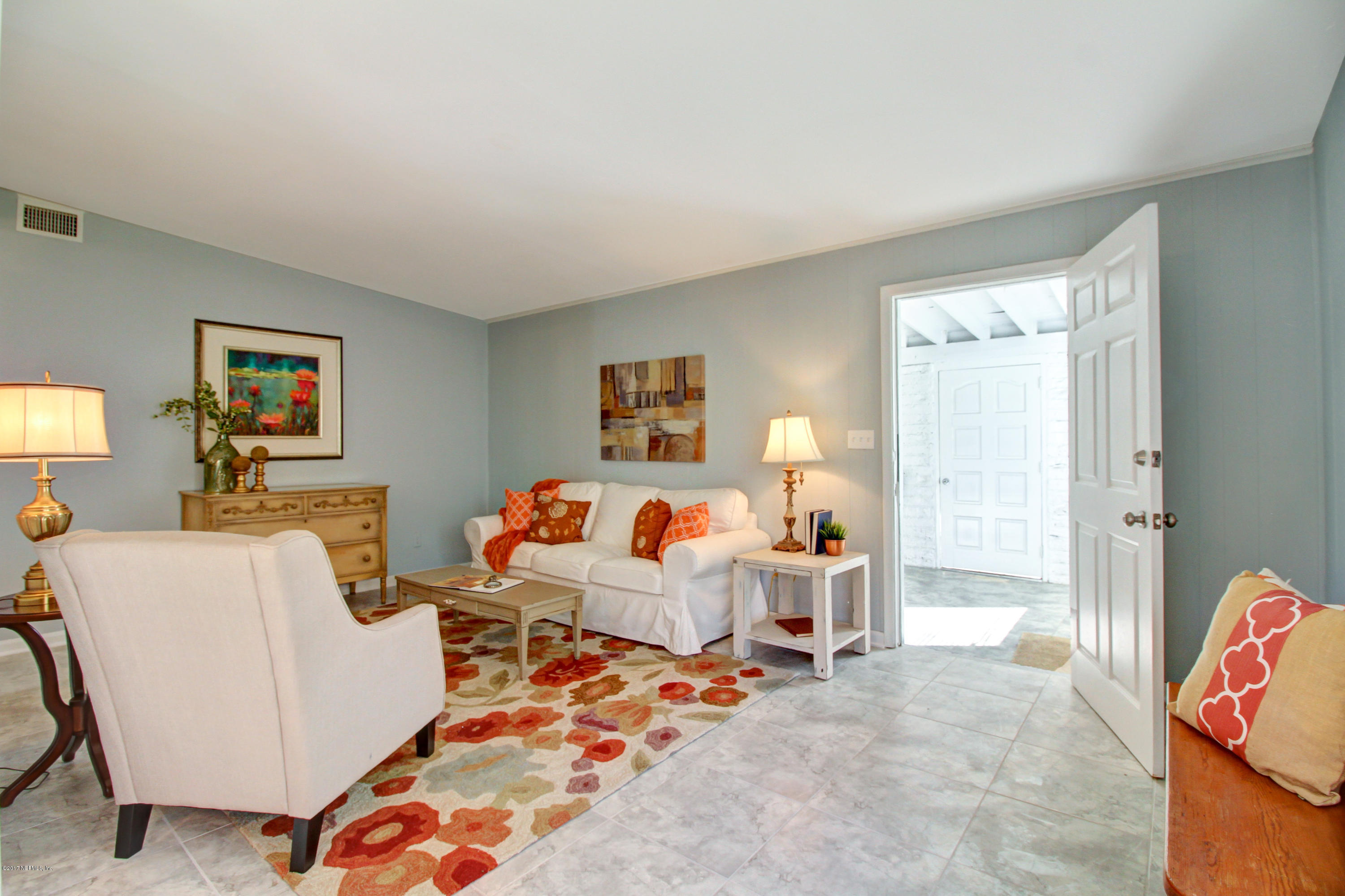 7003 Arques Road Jacksonville, FL 32205 - Photo 13 of 24 a living room with furniture and a couch