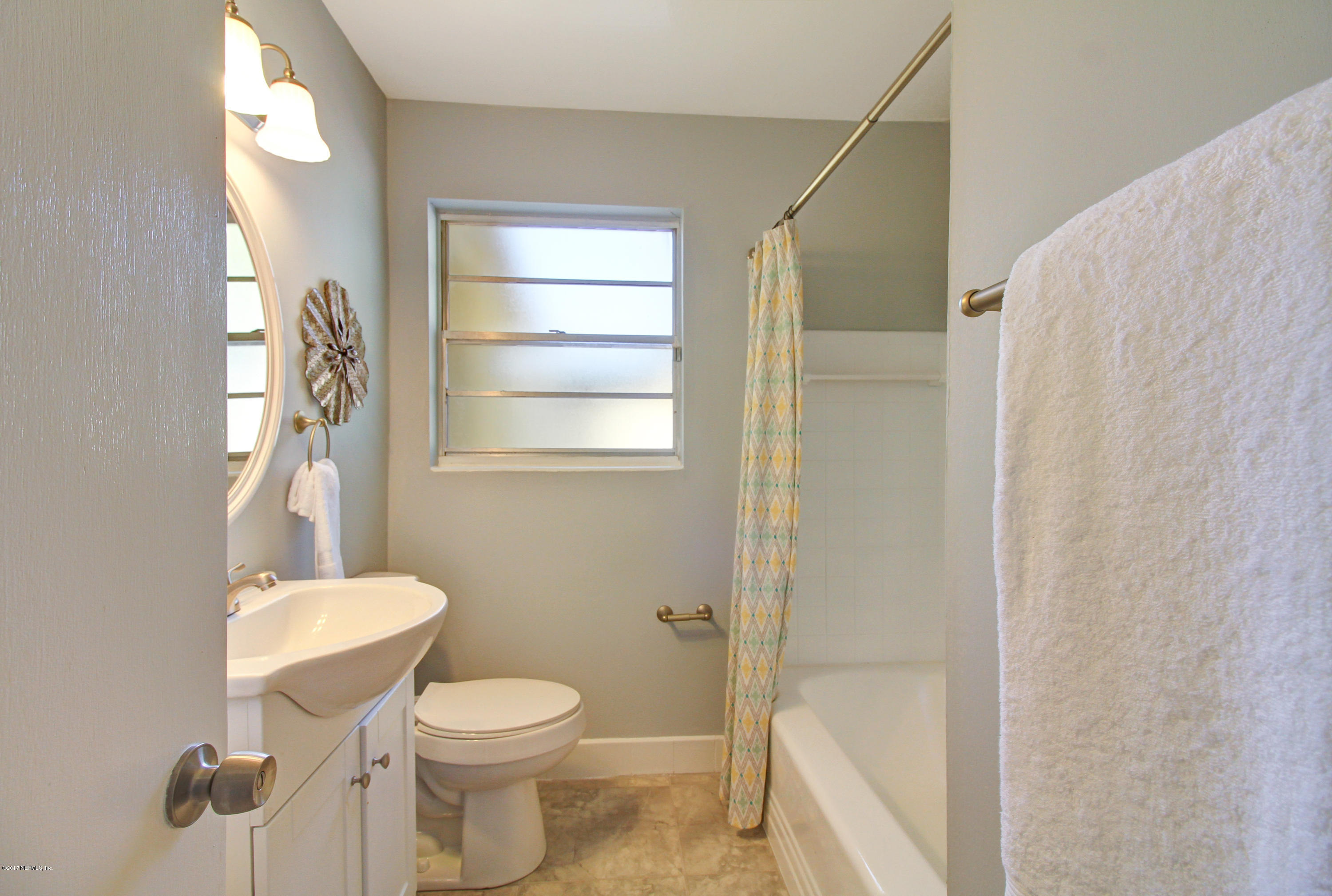7003 Arques Road Jacksonville, FL 32205 - Photo 20 of 24 a bathroom with a toilet and a shower