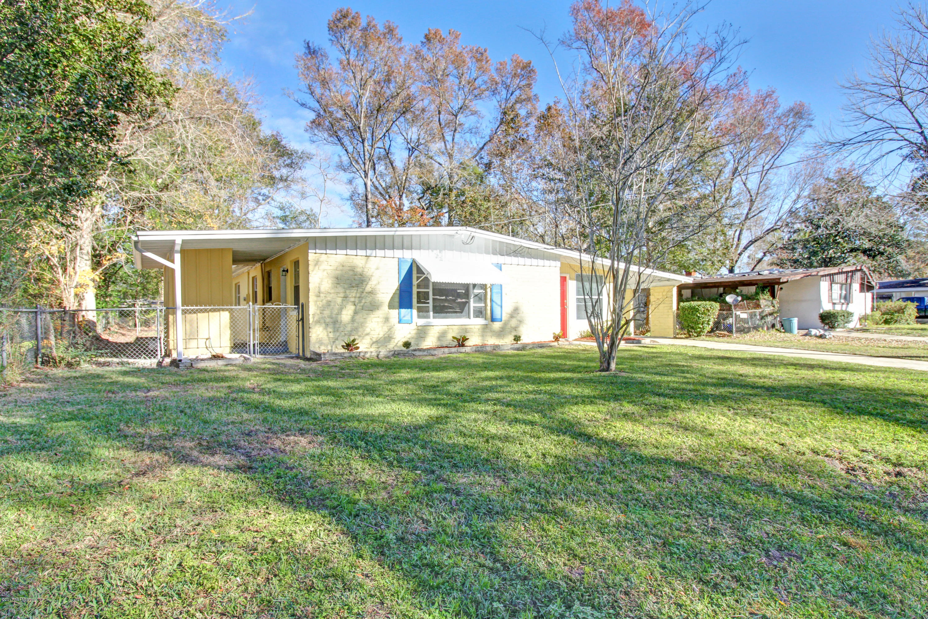 7003 Arques Road Jacksonville, FL 32205 - Photo 4 of 24 a view of a house with a yard