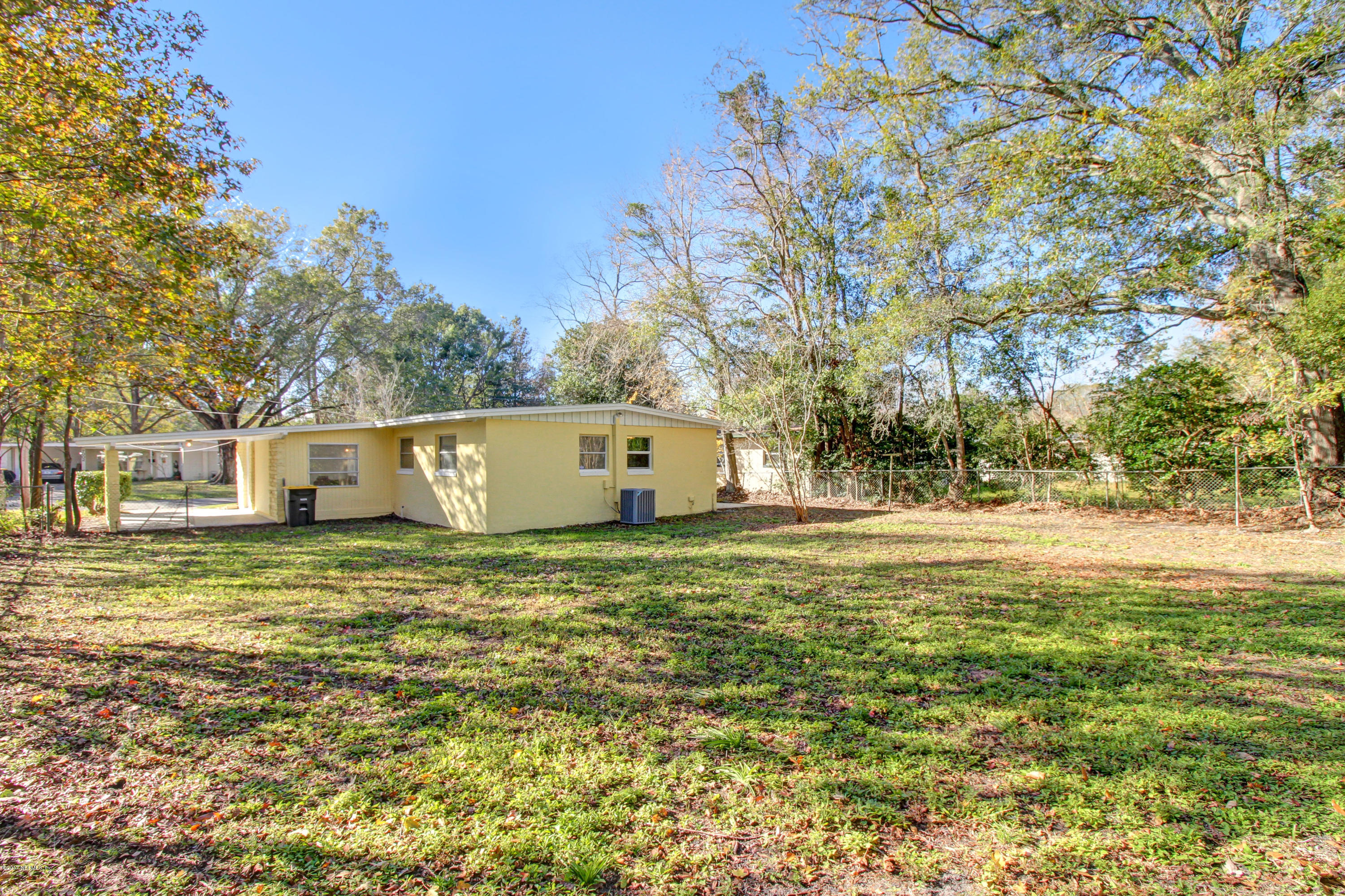 7003 Arques Road Jacksonville, FL 32205 - Photo 6 of 24 a house view with swimming pool in front of it