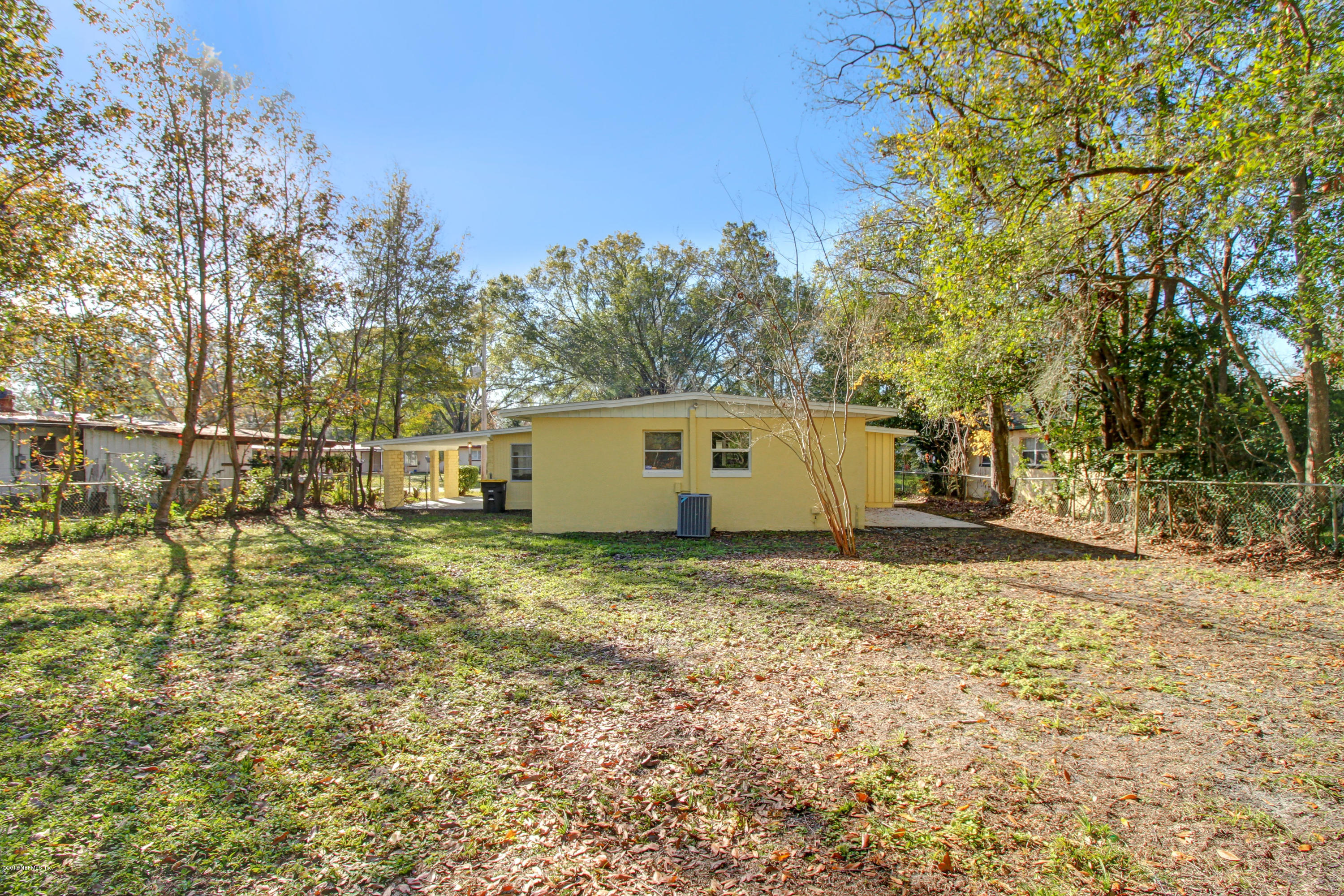 7003 Arques Road Jacksonville, FL 32205 - Photo 7 of 24 a house view with a backyard space