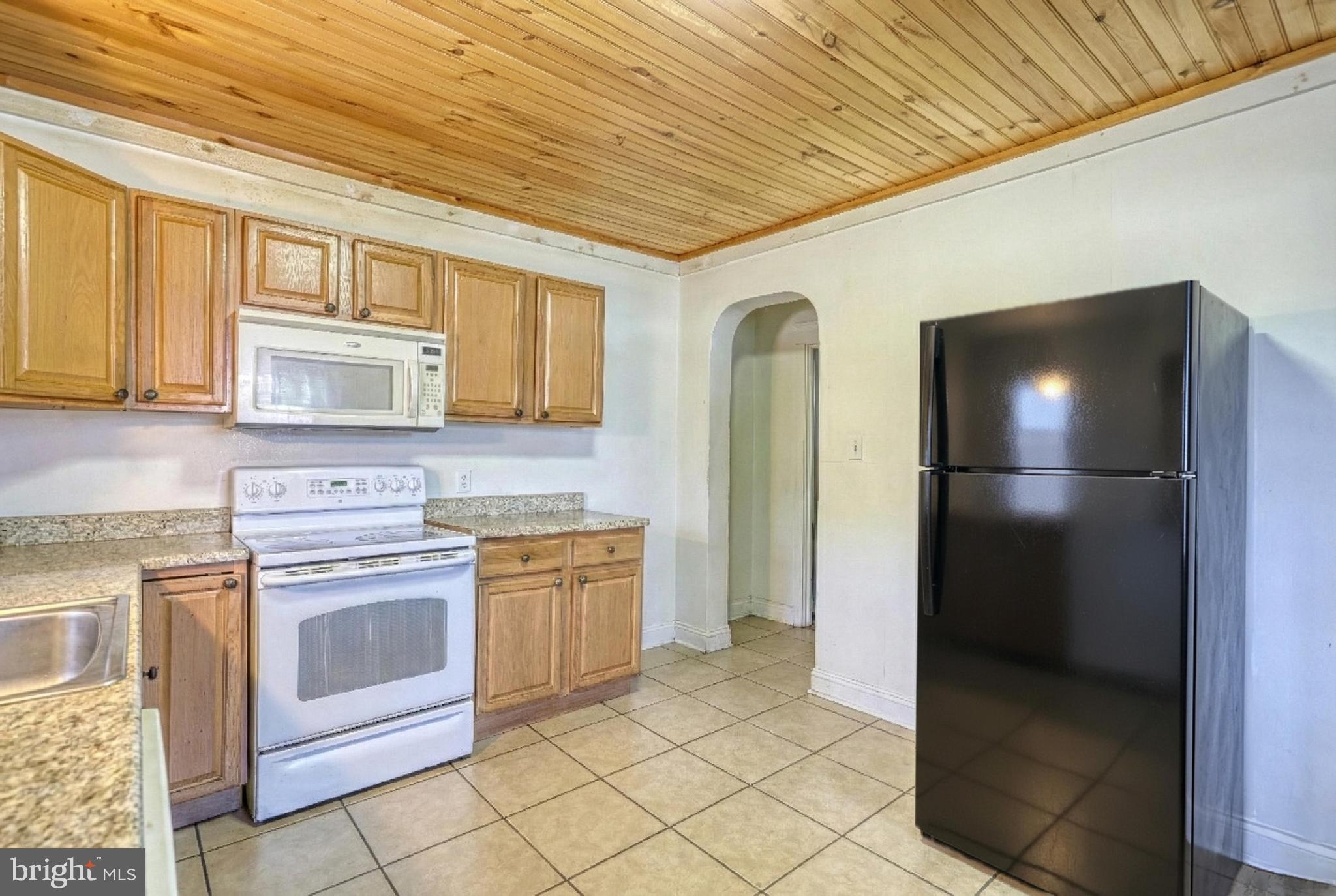 619 Dallas Street York, PA 17403 - Photo 12 of 23 a kitchen with stainless steel appliances granite countertop a refrigerator and a stove top oven