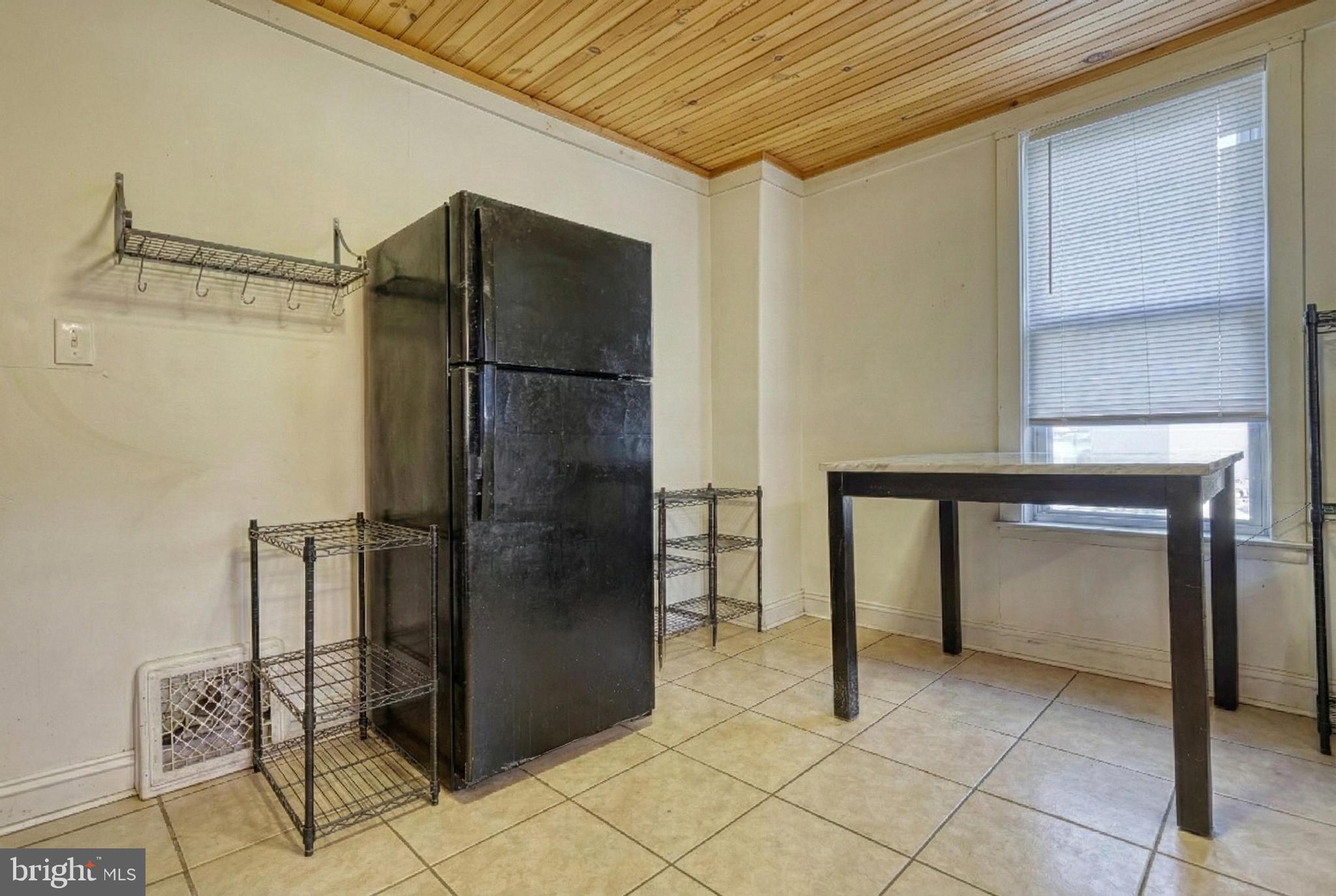 619 Dallas Street York, PA 17403 - Photo 13 of 23 a kitchen with a refrigerator and cabinets