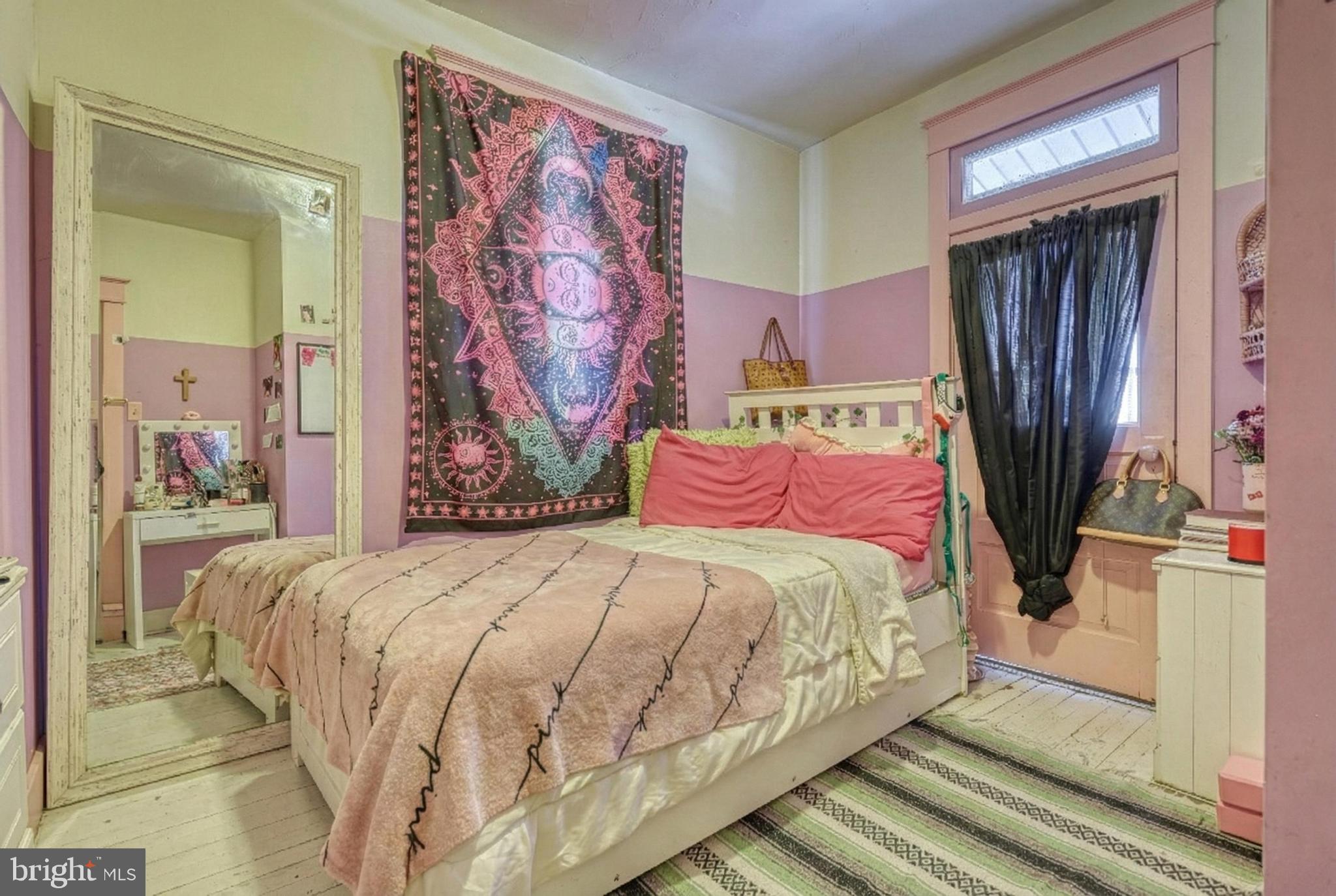 619 Dallas Street York, PA 17403 - Photo 16 of 23 a bedroom with a bed and a painting on the wall