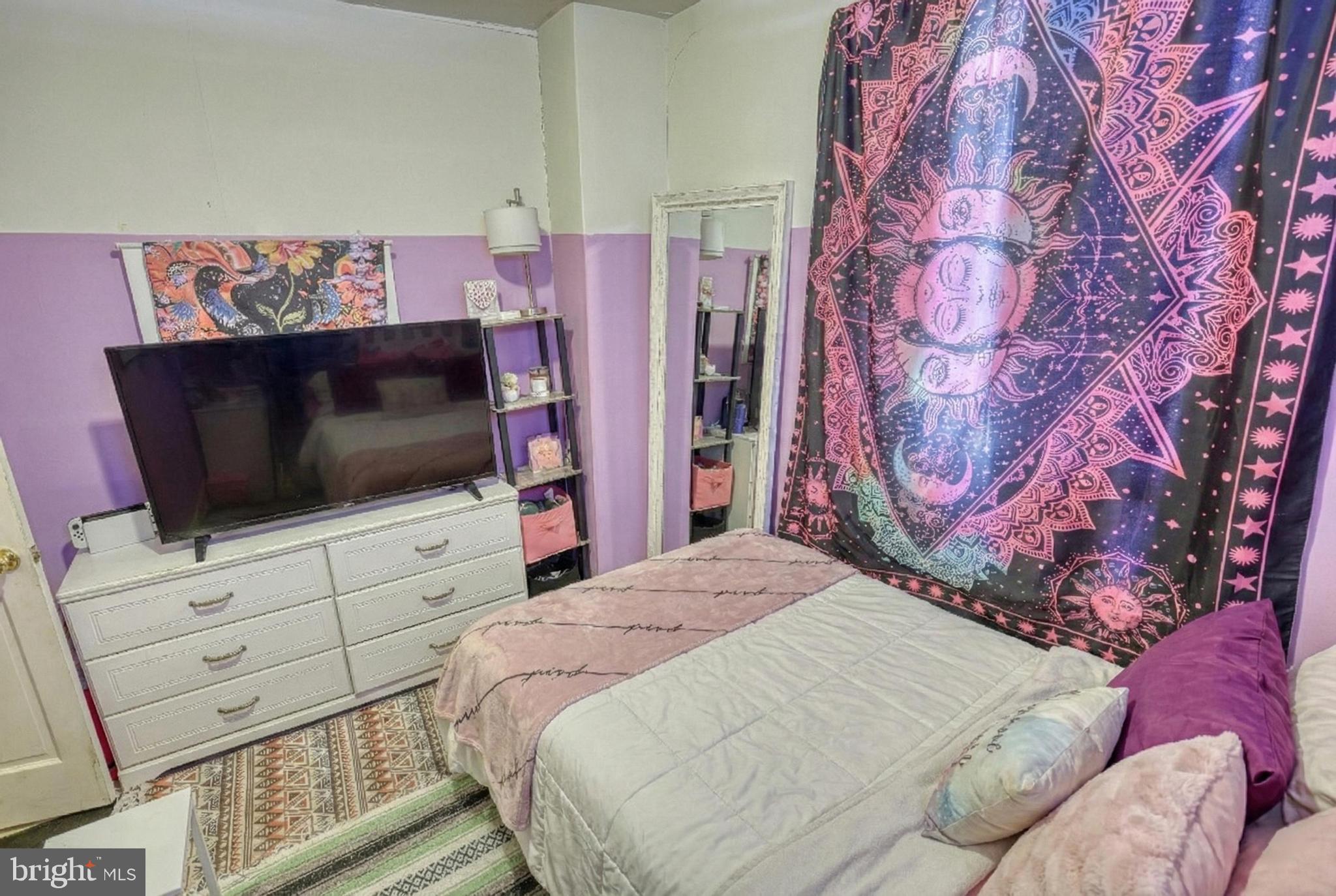 619 Dallas Street York, PA 17403 - Photo 17 of 23 a bedroom with a bed and flat screen tv