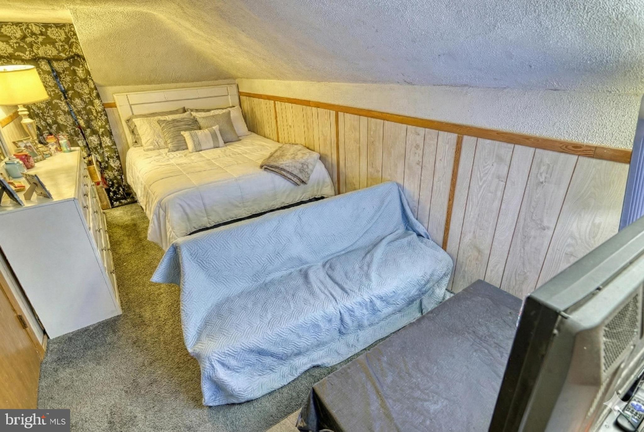 619 Dallas Street York, PA 17403 - Photo 22 of 23 a bedroom with a bed and wooden floor