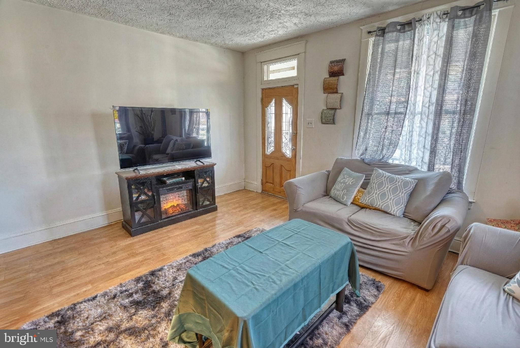619 Dallas Street York, PA 17403 - Photo 7 of 23 a living room with furniture and a flat screen tv