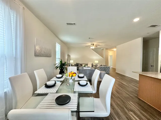 a living room with furniture and a table