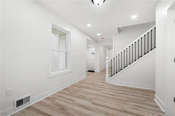 a view of entryway with wooden floor