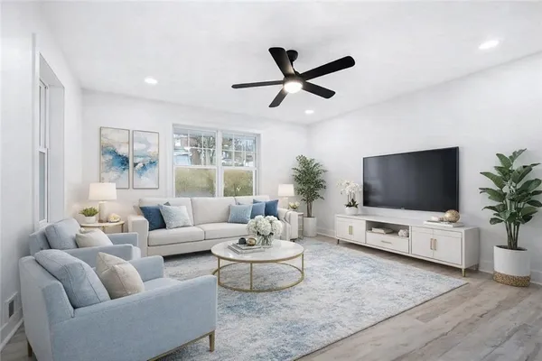 a living room with furniture and a flat screen tv