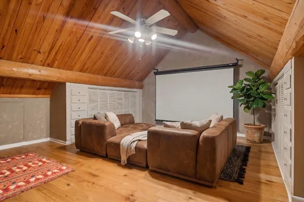 a bedroom with furniture and a potted plant