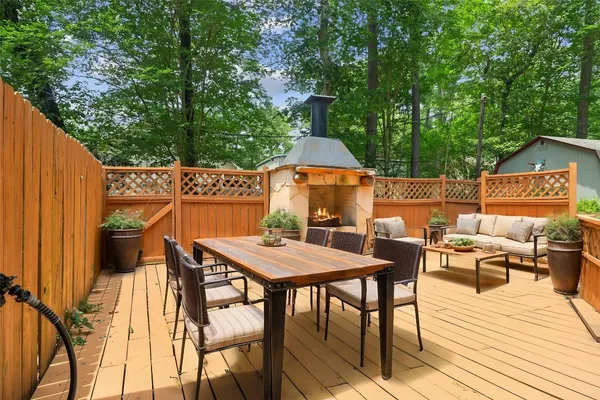 a view of backyard of house with seating space