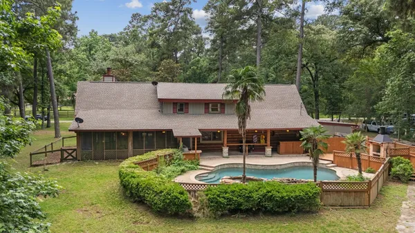 aerial view of a house with swimming pool and sitting area