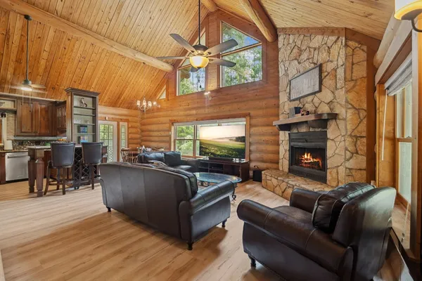 a living room with furniture oven and a fireplace
