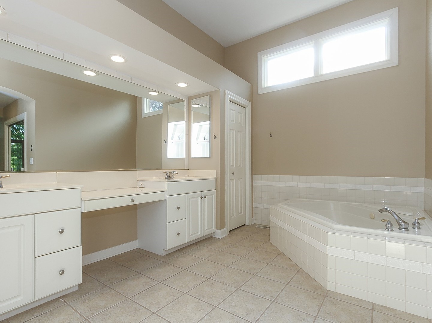 261 Course Drive Lake In The Hills, IL 60156 - Photo 14 of 35 a bathroom with a tub sink and a mirror