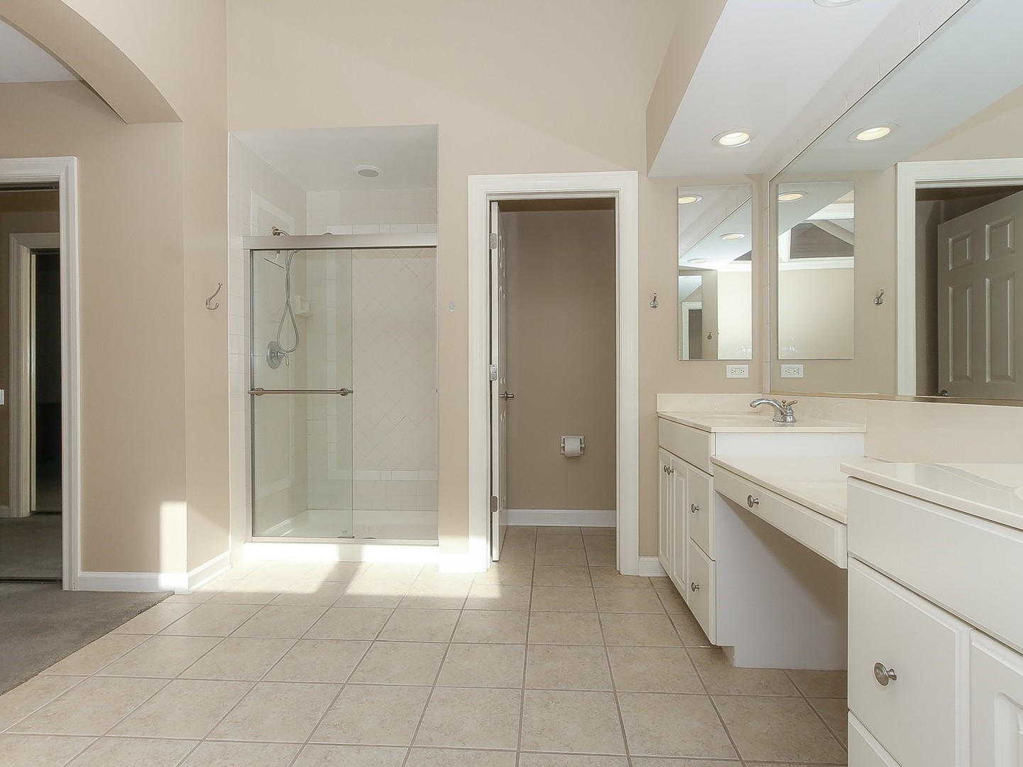 261 Course Drive Lake In The Hills, IL 60156 - Photo 15 of 35 a bathroom with a granite countertop sink a mirror and a shower