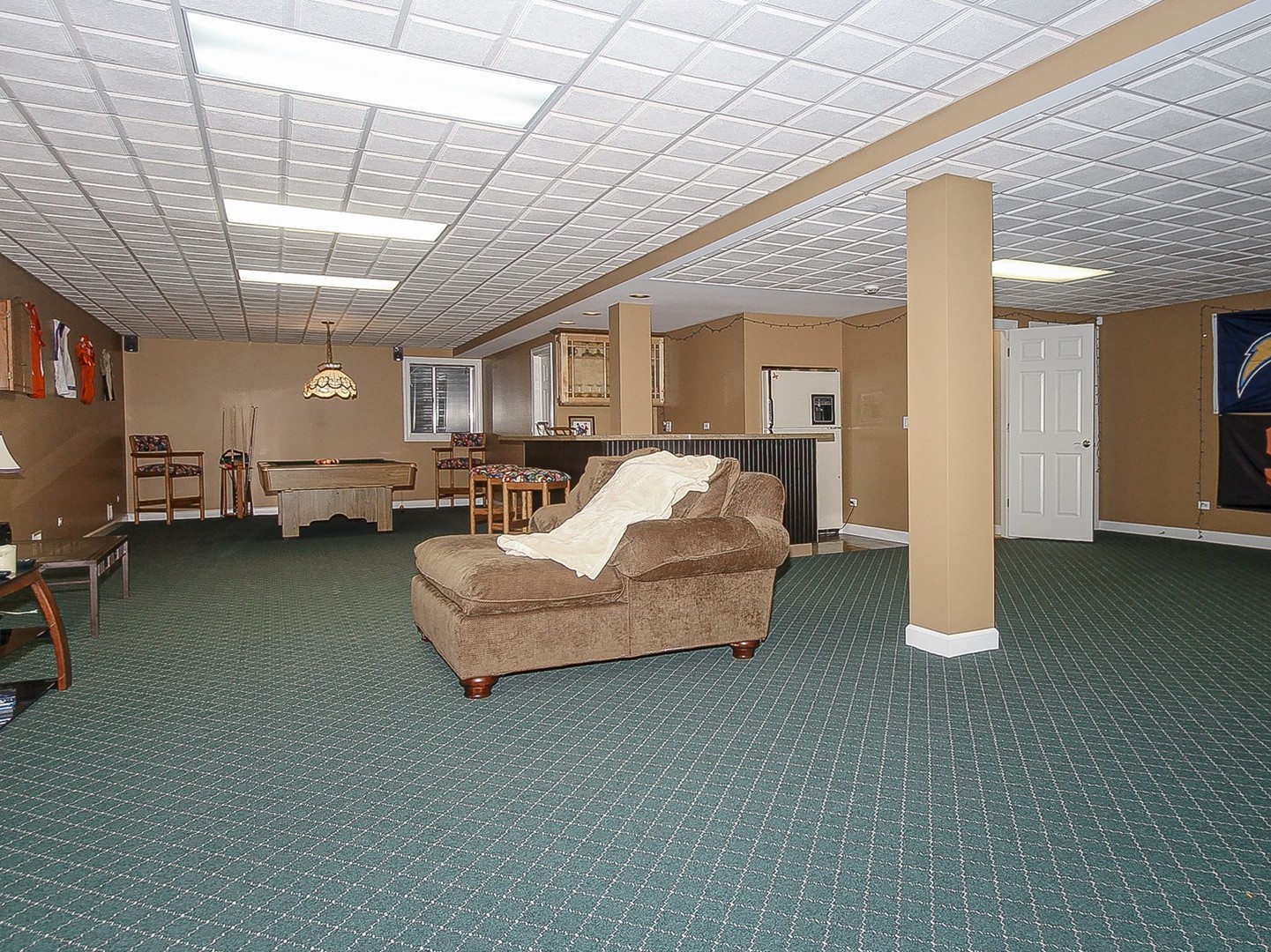 261 Course Drive Lake In The Hills, IL 60156 - Photo 21 of 35 a living room with furniture and a chandelier