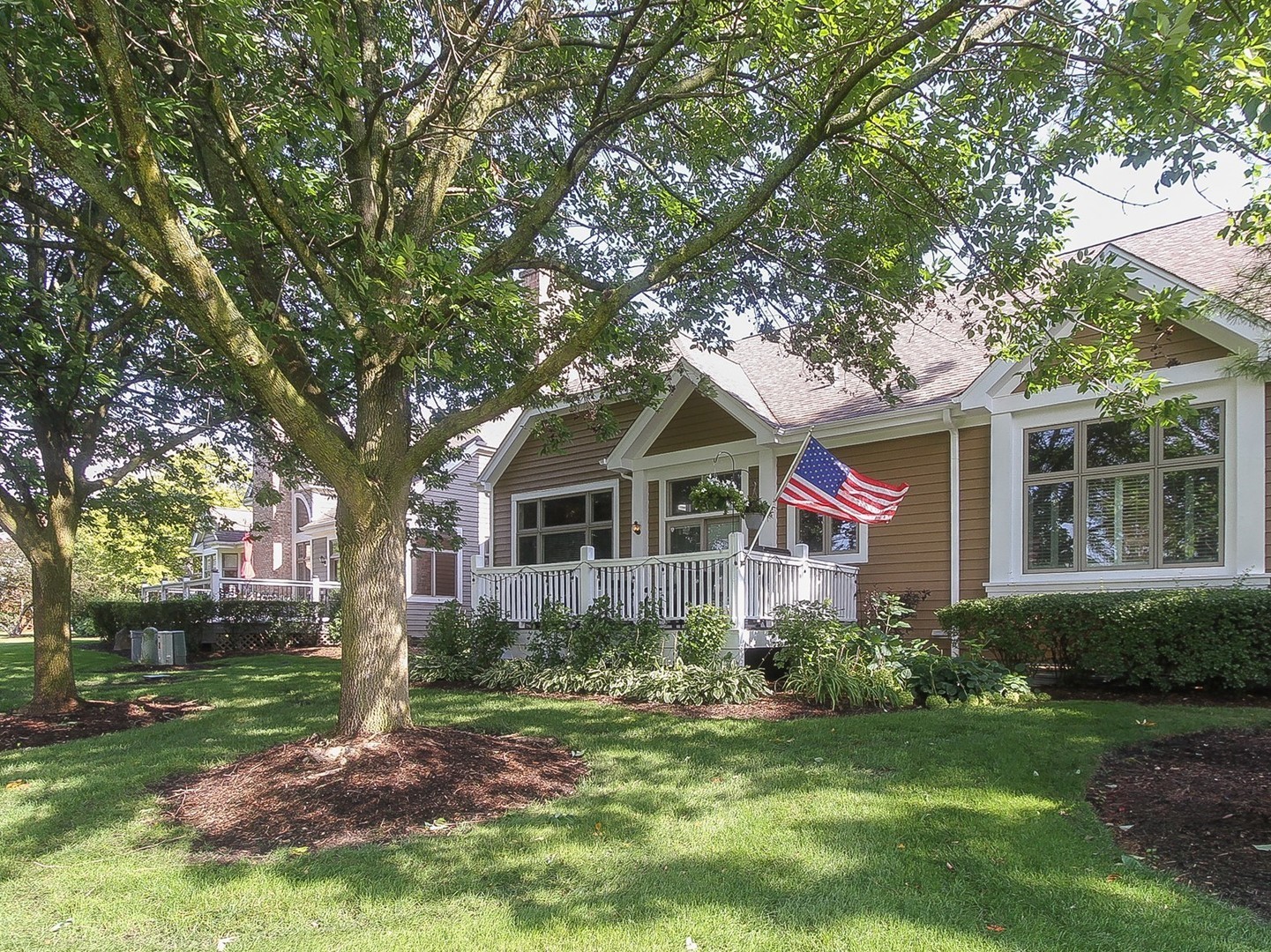 261 Course Drive Lake In The Hills, IL 60156 - Photo 25 of 35 a front view of a house with garden