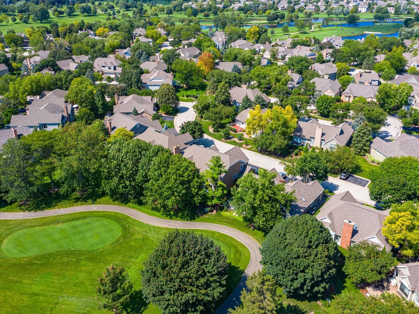 261 Course Drive Lake In The Hills, IL 60156 - Photo 28 of 35 an aerial view of residential houses with outdoor space and trees