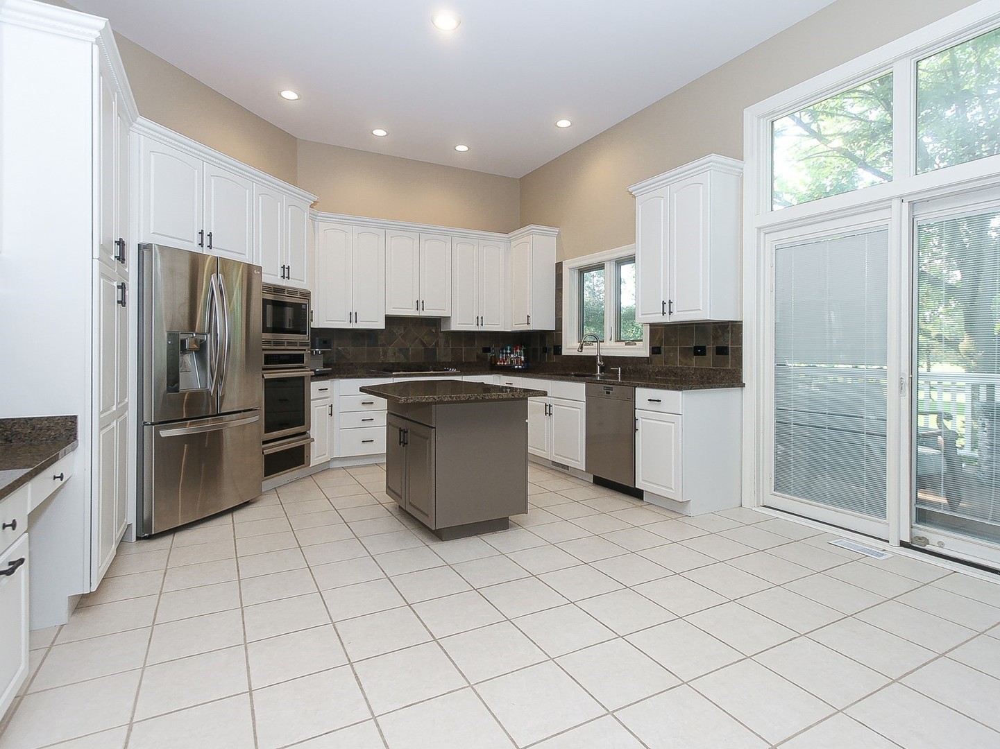 261 Course Drive Lake In The Hills, IL 60156 - Photo 8 of 35 a kitchen with stainless steel appliances a refrigerator sink and microwave