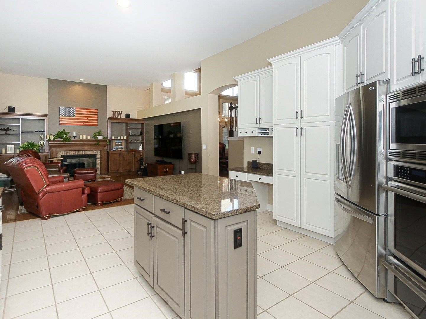 261 Course Drive Lake In The Hills, IL 60156 - Photo 9 of 35 a kitchen with stainless steel appliances kitchen island granite countertop a refrigerator and a stove top oven