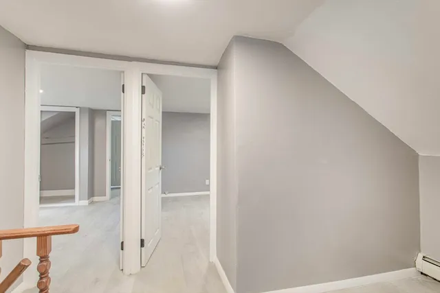 a bathroom with a shower and a toilet