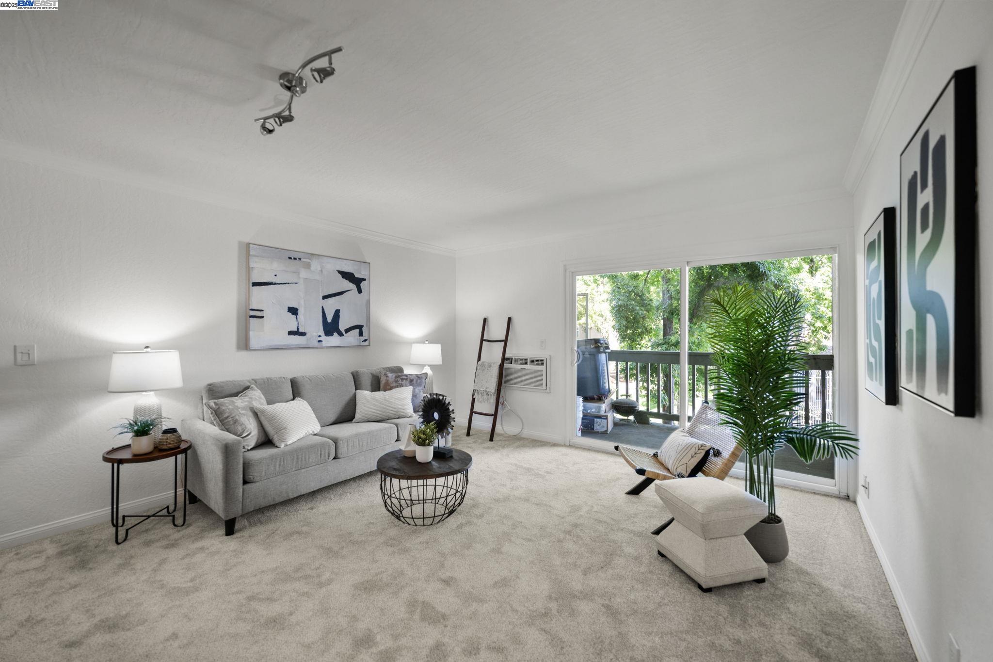 1085 Murrieta Boulevard, Unit 222 Livermore, CA 94550 - Photo 14 of 25 a living room with furniture and a large window