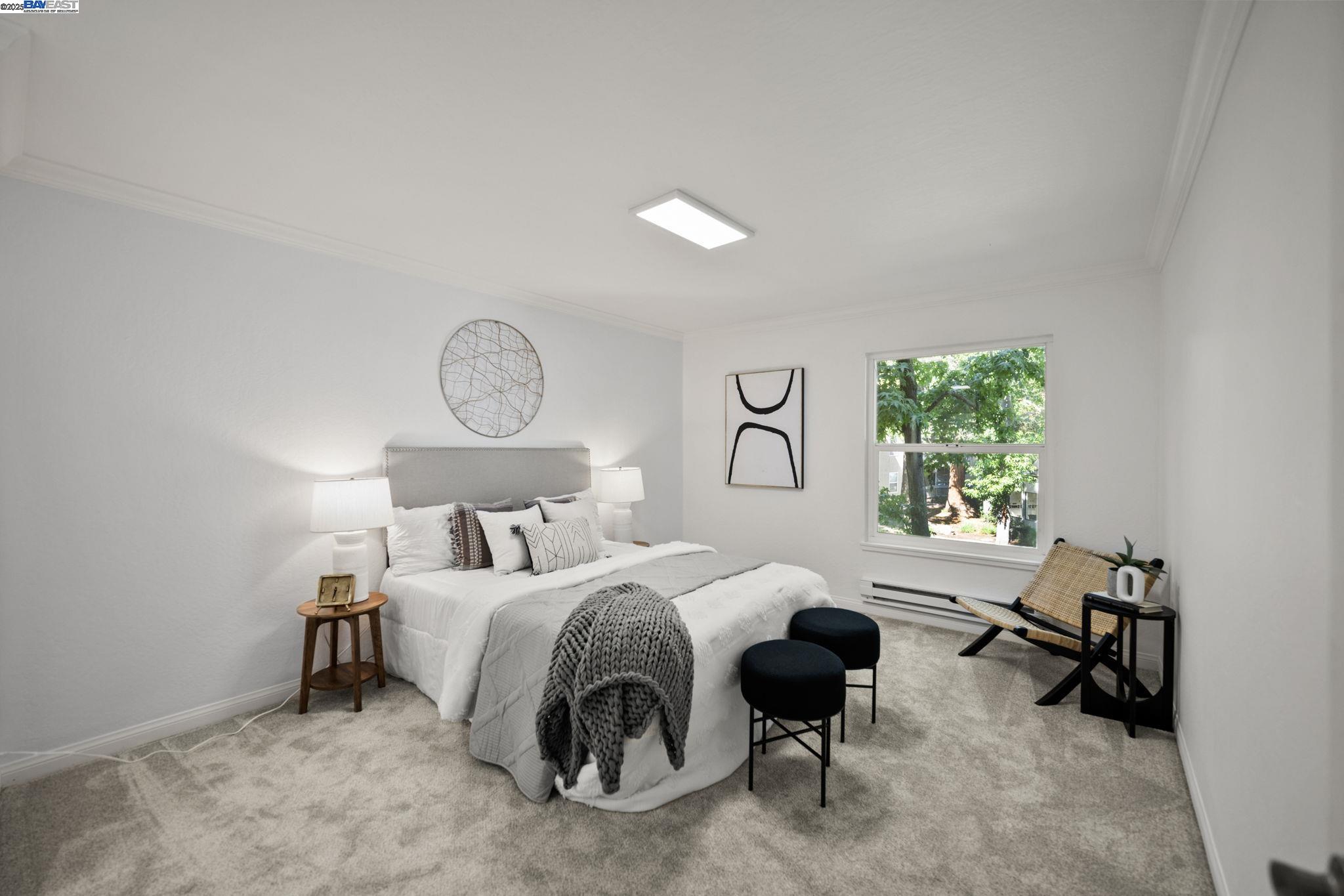 1085 Murrieta Boulevard, Unit 222 Livermore, CA 94550 - Photo 15 of 25 a bedroom with a bed and a table in it