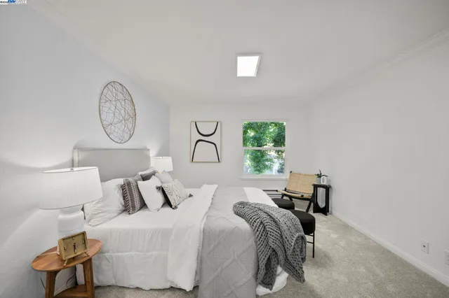 a bedroom with bed and a table