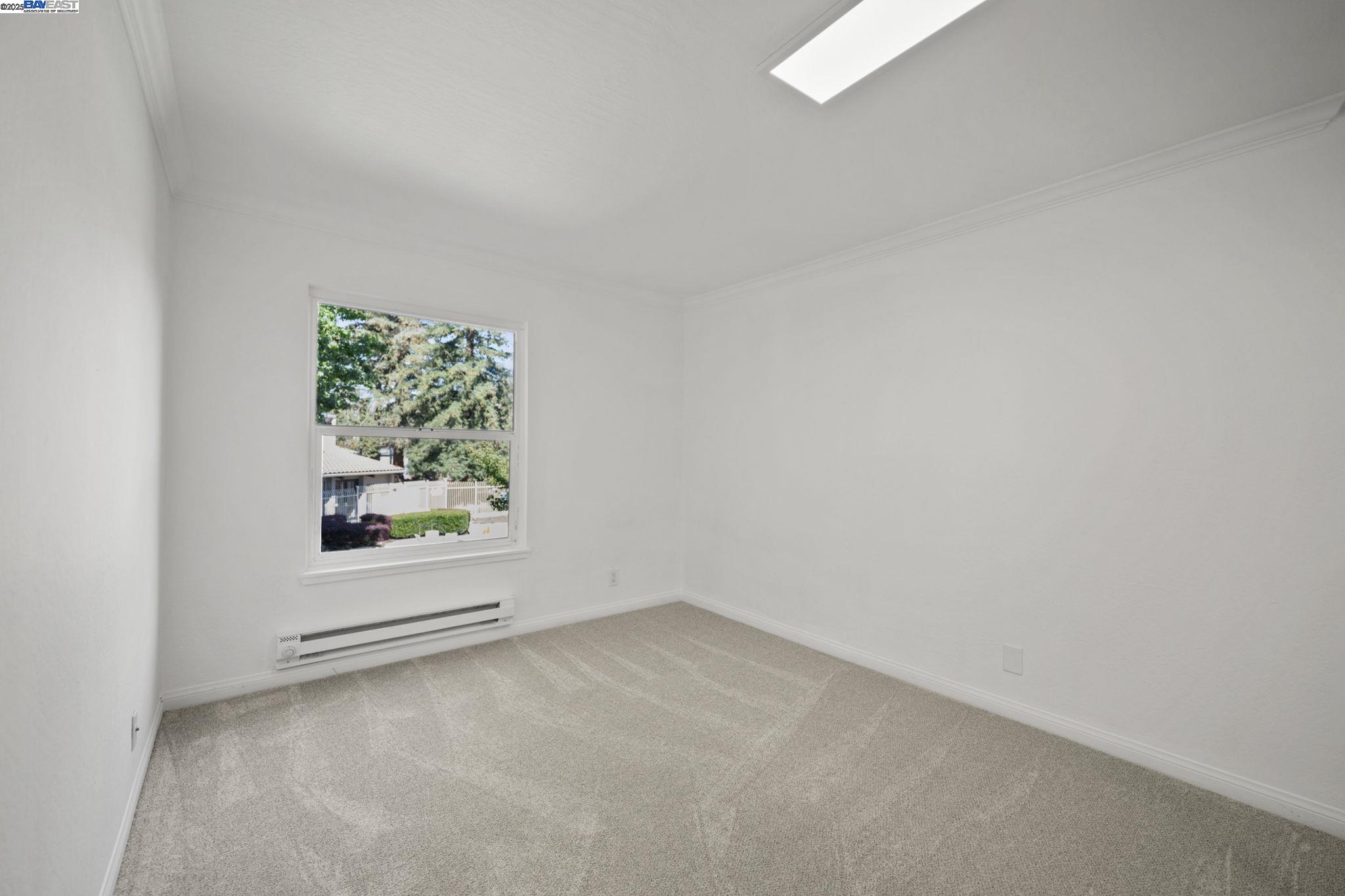 1085 Murrieta Boulevard, Unit 222 Livermore, CA 94550 - Photo 20 of 25 an empty room with windows