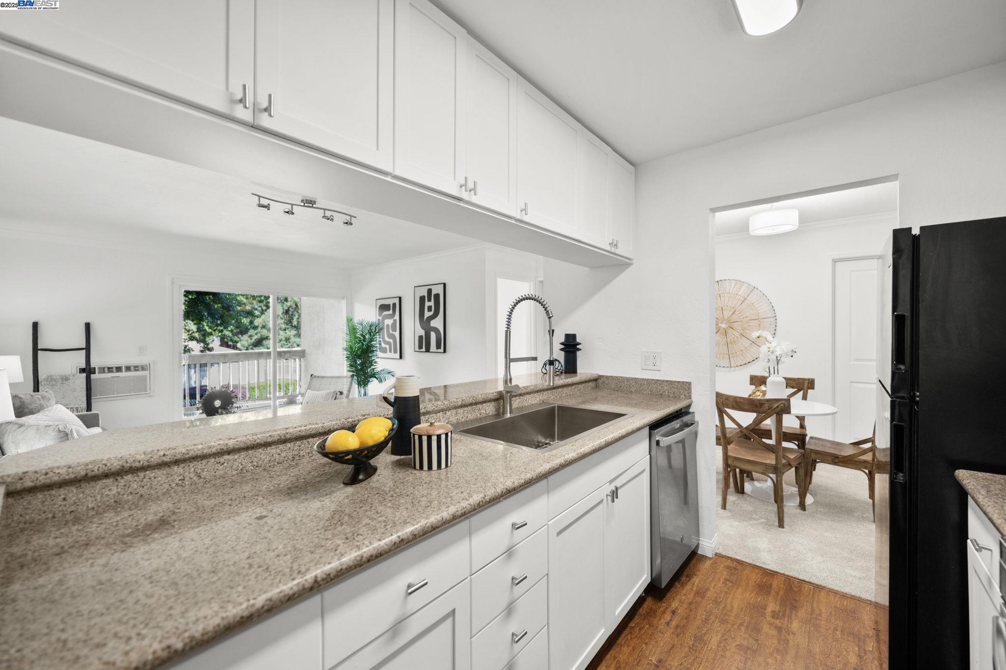 1085 Murrieta Boulevard, Unit 222 Livermore, CA 94550 - Photo 4 of 25 a kitchen with sink and cabinets
