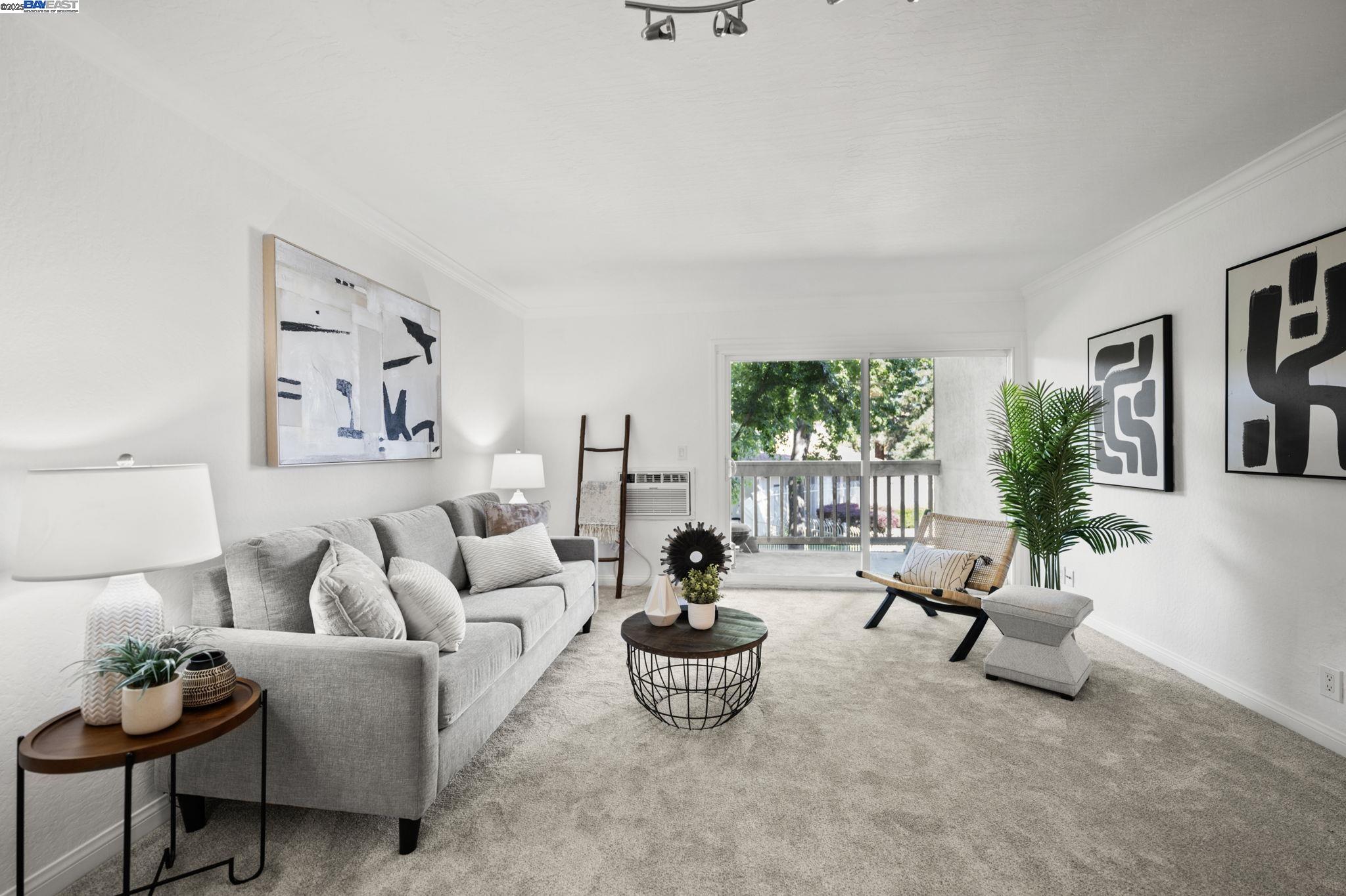 1085 Murrieta Boulevard, Unit 222 Livermore, CA 94550 - Photo 8 of 25 a living room with furniture and a large window
