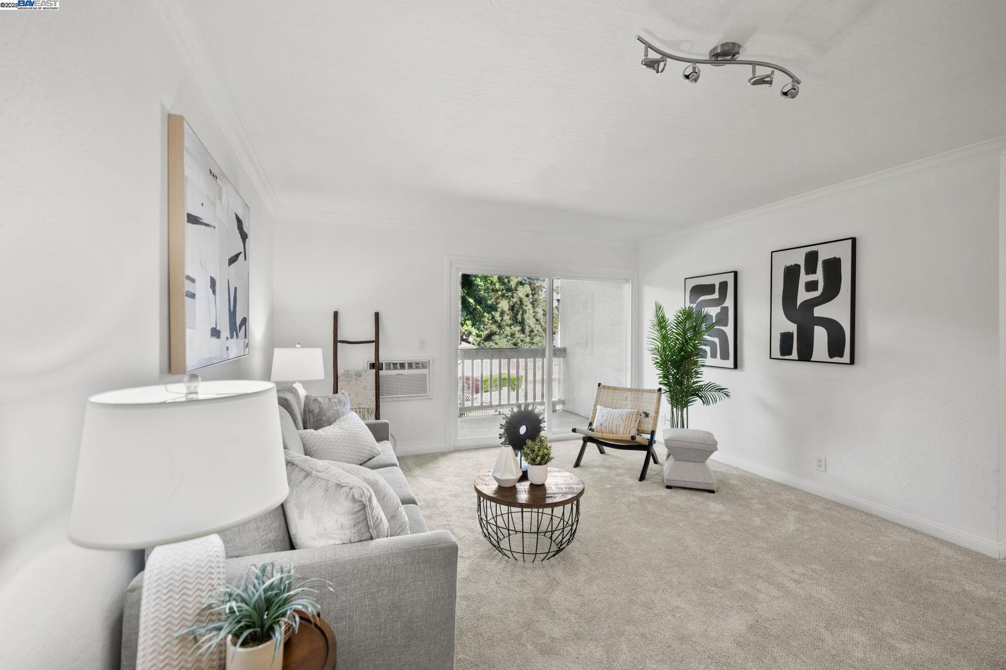 1085 Murrieta Boulevard, Unit 222 Livermore, CA 94550 - Photo 9 of 25 a living room with furniture and a potted plant